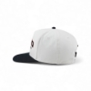 Angled back-left view of the Lund Big Catch Hat showing the light-colored crown, adjustable closure, and black bill.