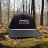 Lund Drift Hat on mossy stump