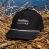 und Drift Hat in front of lake