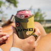 Woman holding Bass Koozie on beach
