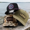 Three Lund Boats hats staged on a pier