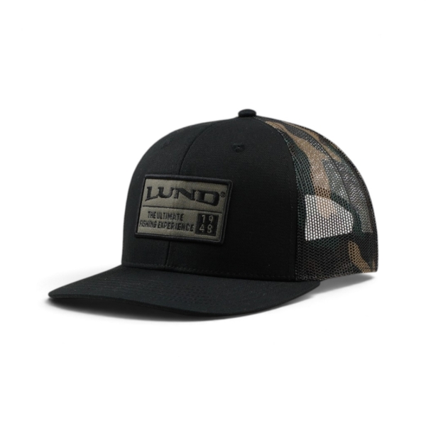 Angled front view of the black and camo Lund hat featuring a rectangular embroidered Lund patch on the front panel